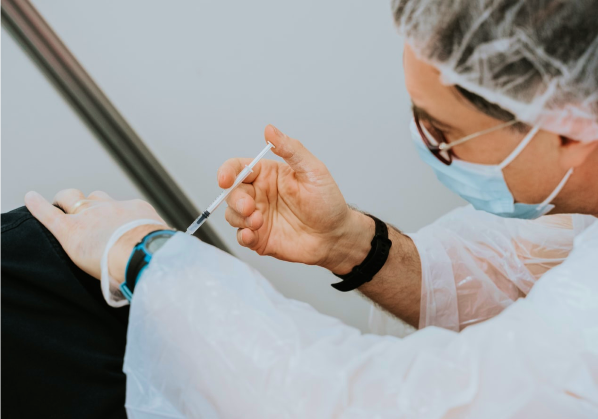Clinician giving a vaccination
